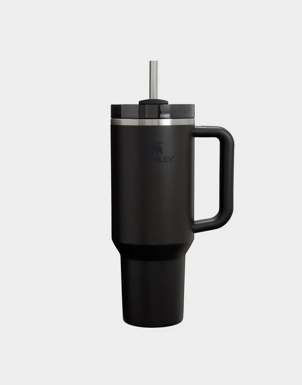 The source photo: a black travel tumbler with a handle and straw